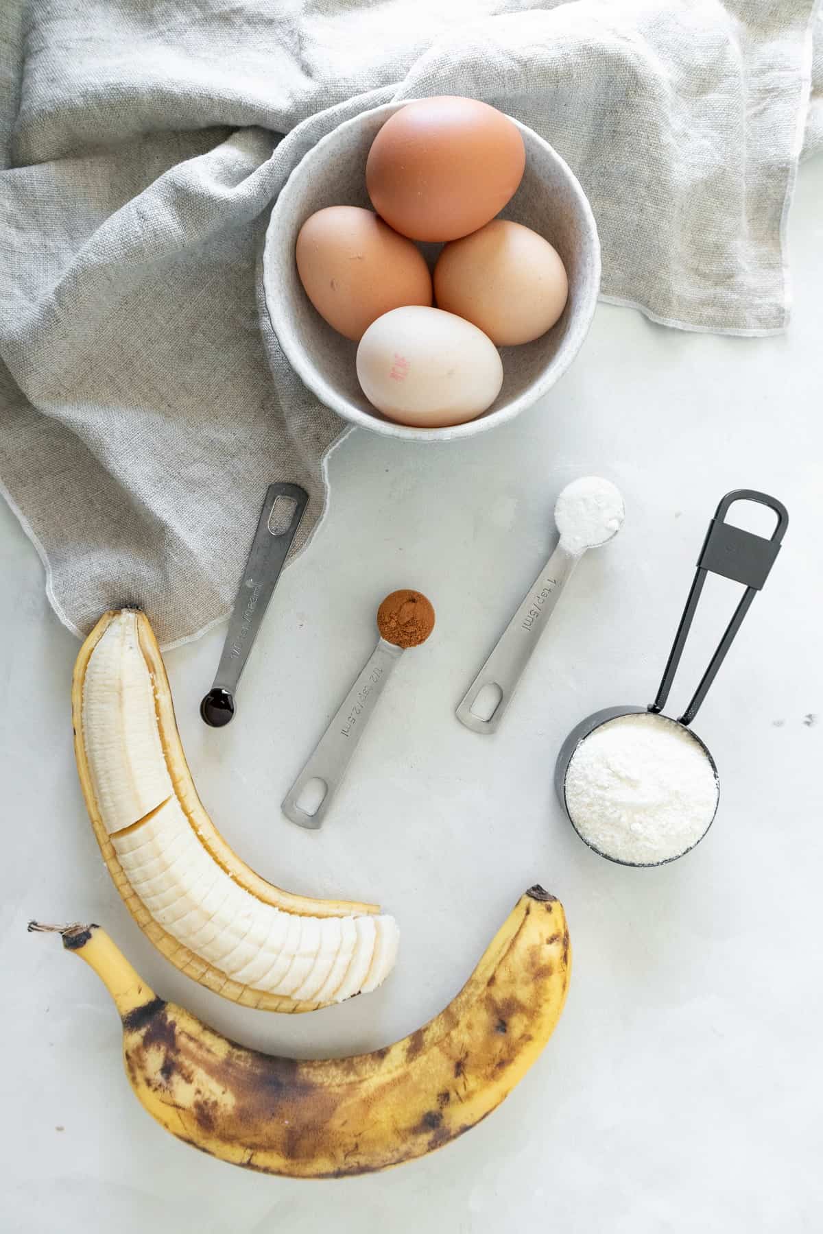 coconut flour banana pancakes ingredients on benchtop
