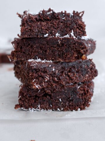 Chocolate coconut slice squares stacked