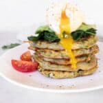 Potato fritters (gluten-free) stacked with spinach, avocado and poached egg square