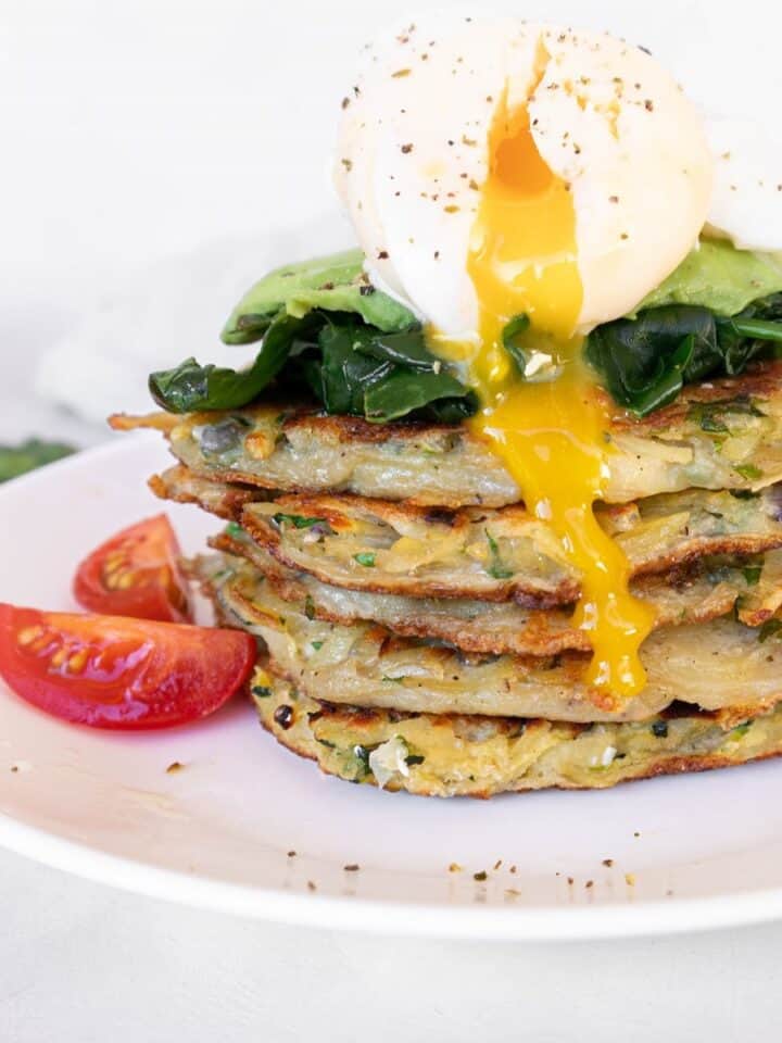 Potato fritters (gluten-free) stacked with spinach, avocado and poached egg square