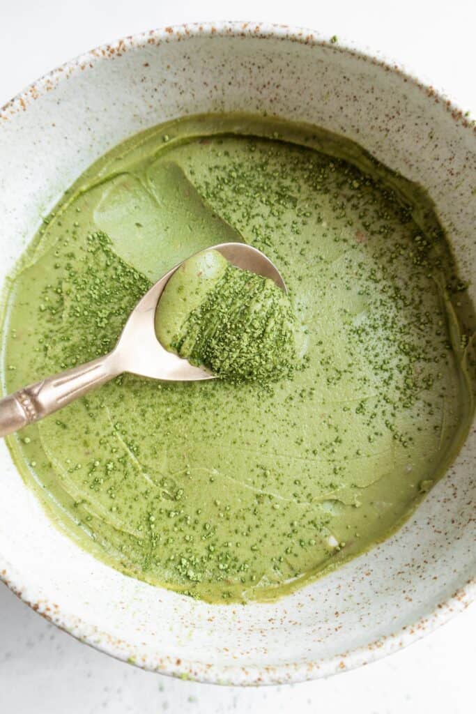 Matcha mousse in a bowl with a spoon