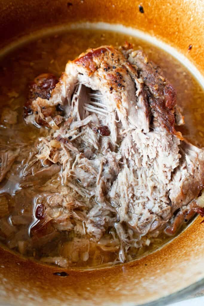 Pull apart the pork in the dutch oven