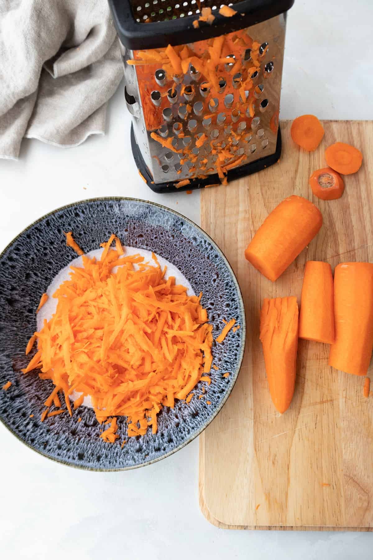 carrots cut in chunks and shredded with box grater