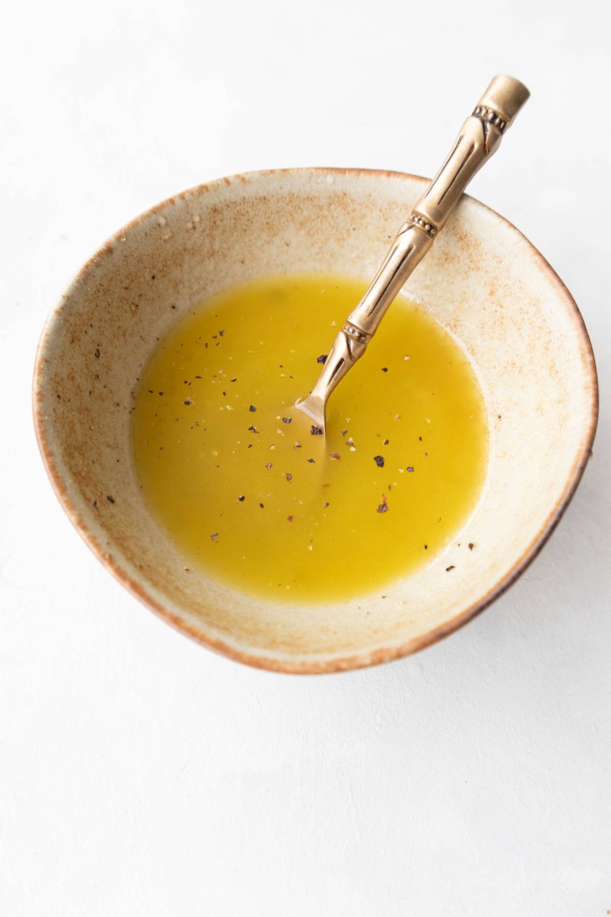 lemon and olive oil dressing made on small bowl