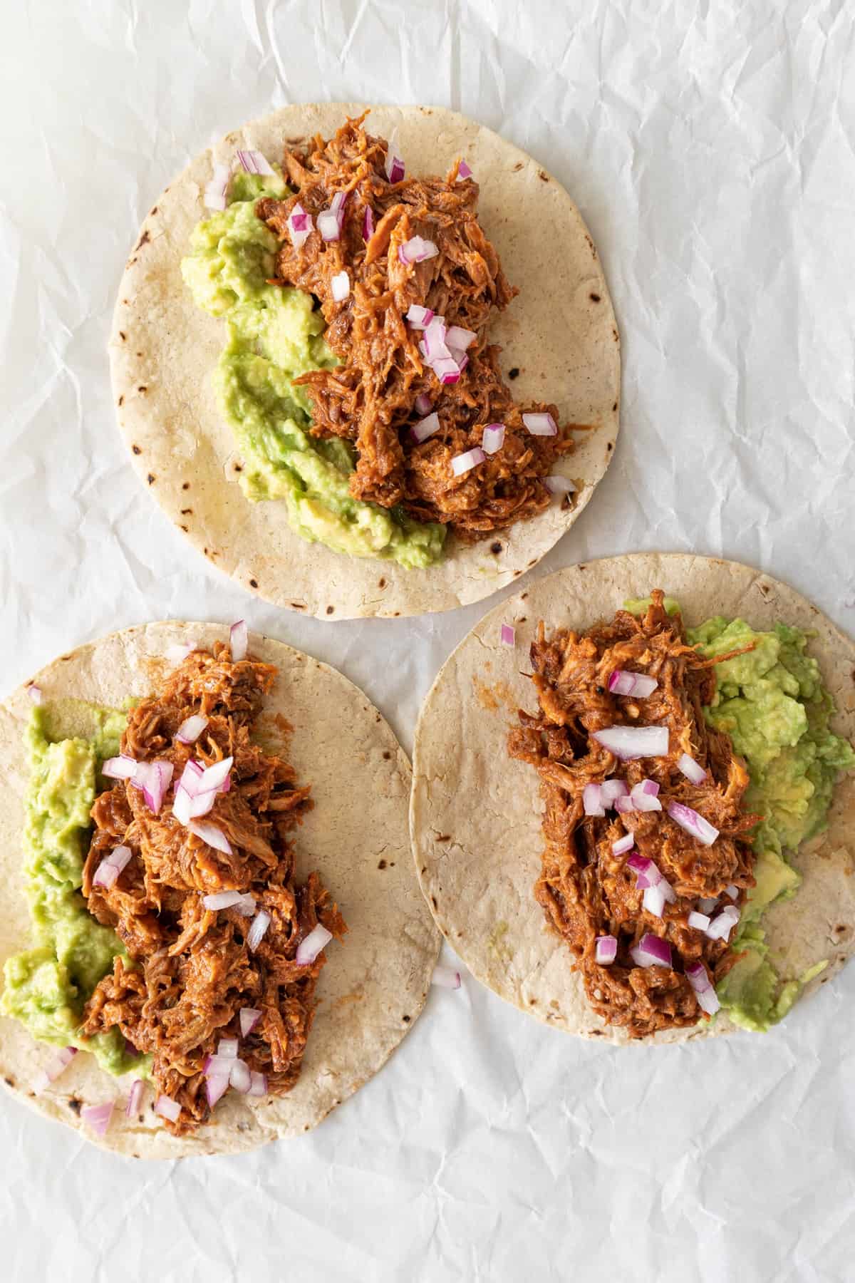 tortillas with avo, pulled pork and diced purple onion