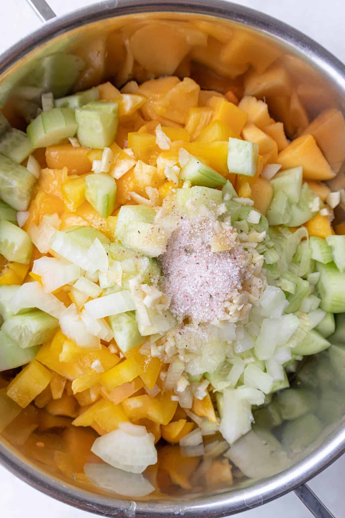 Combine all the mango gazpacho ingredients on a large pot