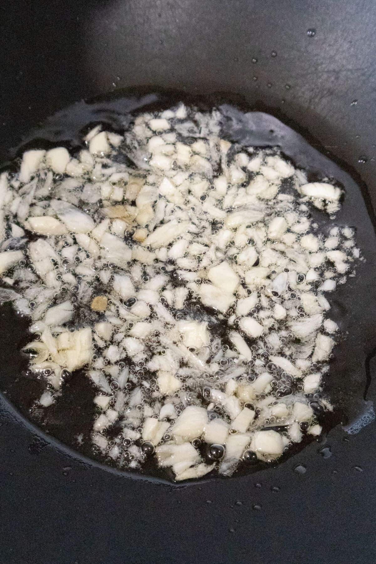 Cooking diced garlic in oil