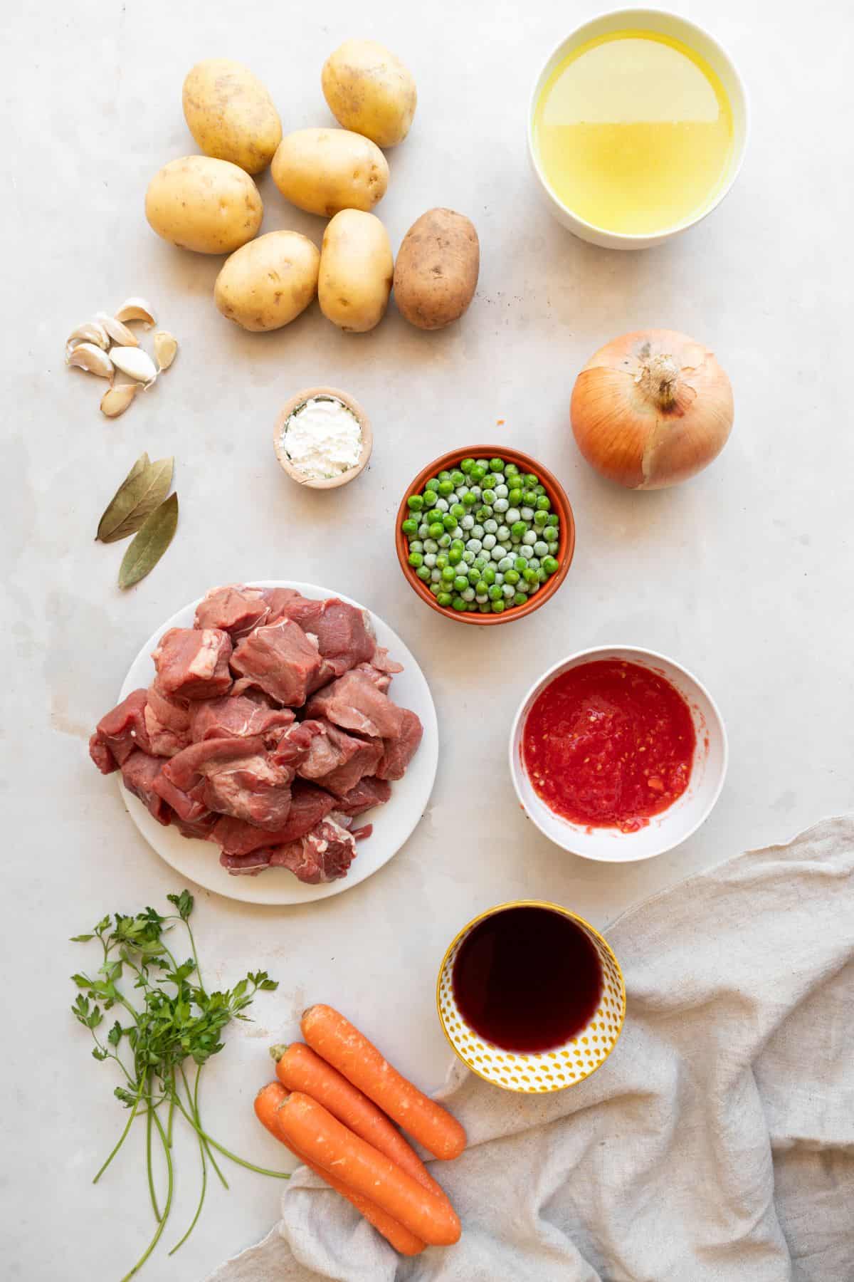 Spanish beef stew ingredients on benchtop