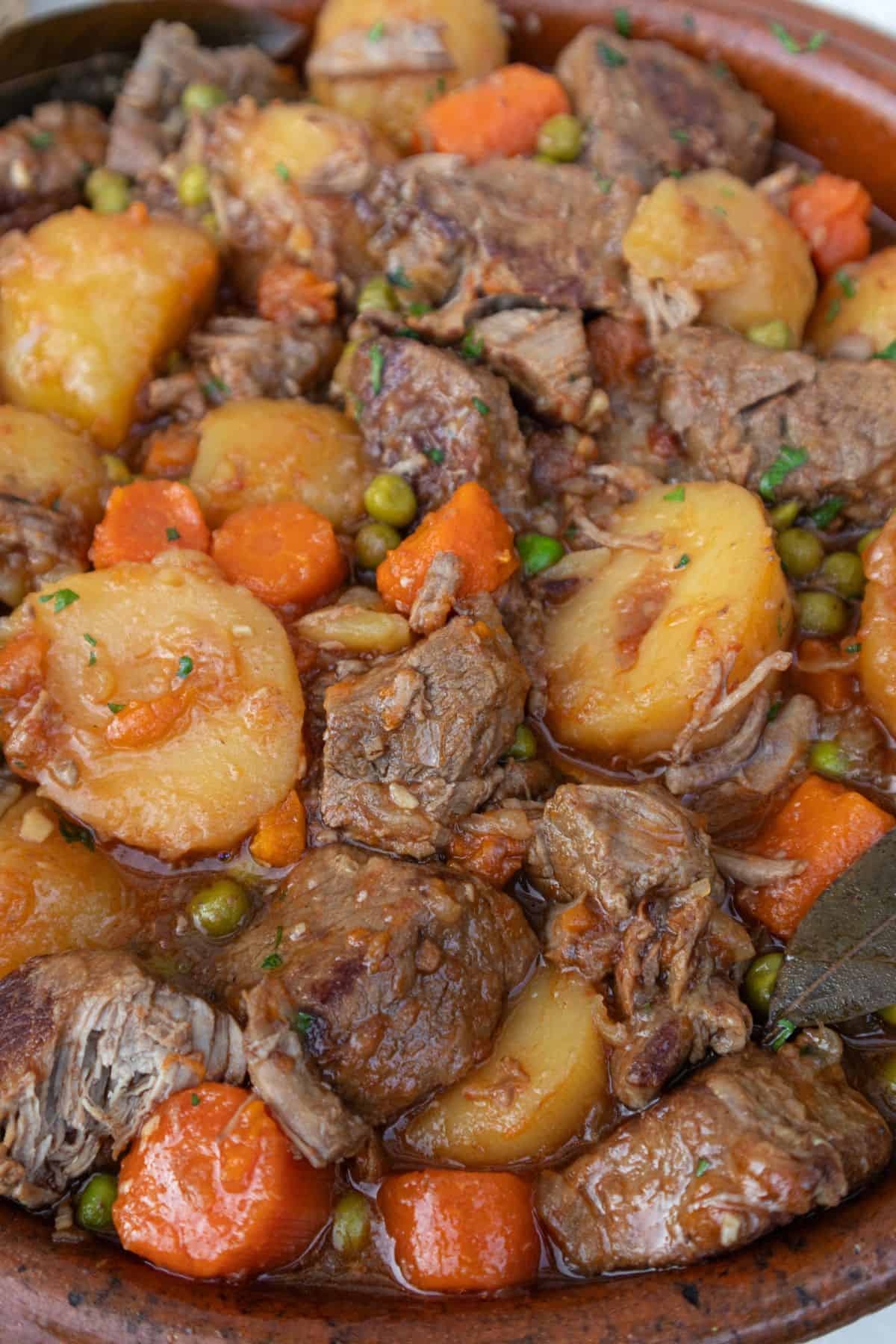 Spanish beef stew with carrots, potatoes and peas