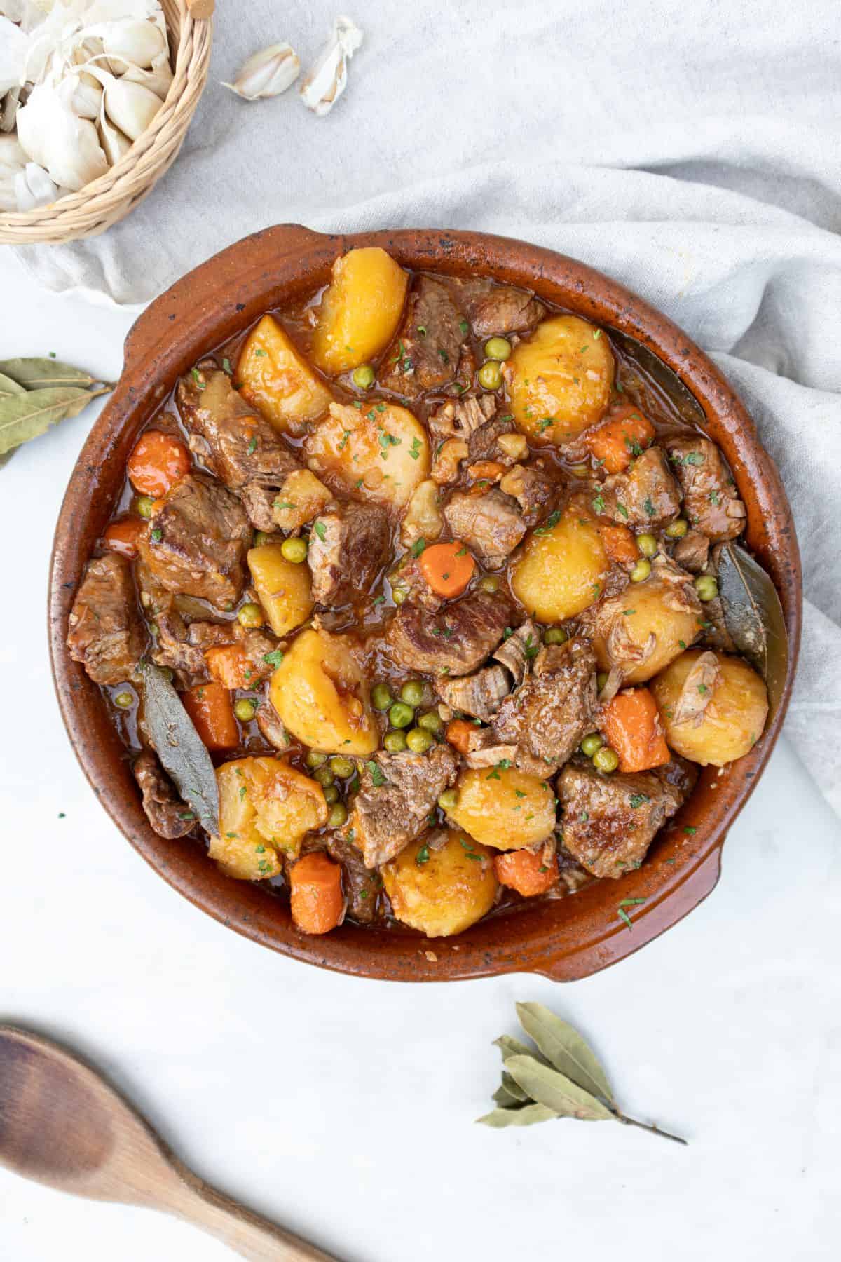 Spanish beef stew with carrots, potatoes and peas