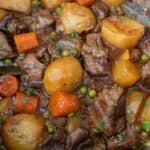 Spanish beef stew with potatoes, carrots and peas
