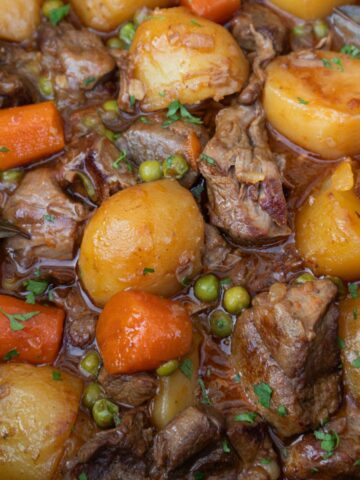 Spanish beef stew with potatoes, carrots and peas
